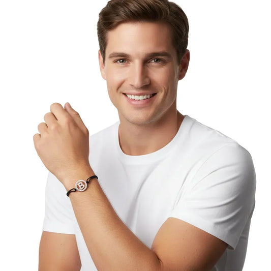 Man wearing a diamond-studded letter B bracelet with black band on wrist