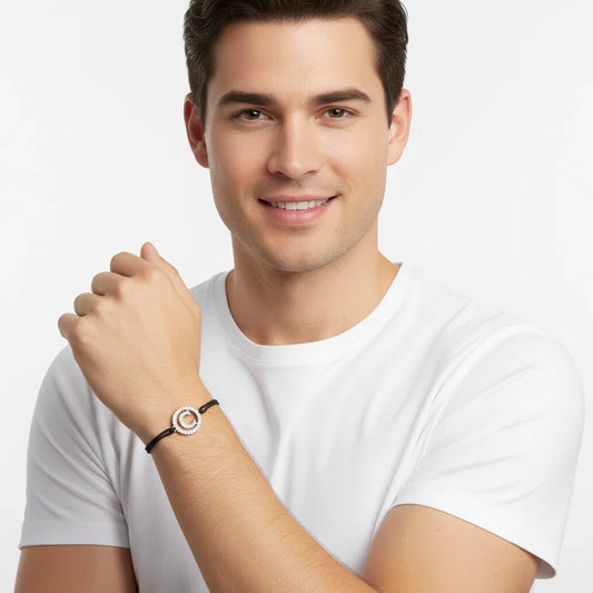 Man wearing a silver diamond alphabet C bracelet on black cord