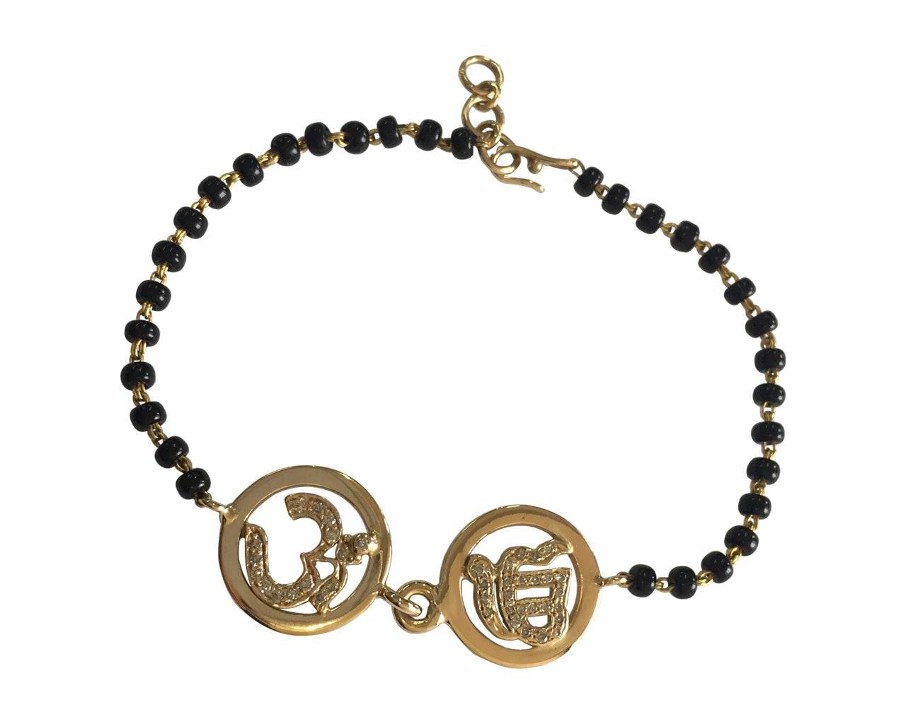 Om & Ik Onkaar joint bracelet in gold on mangal sutra chain - Jewelslane