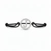 Black cord bracelet with diamond-studded initial J charm, minimalist jewellery design