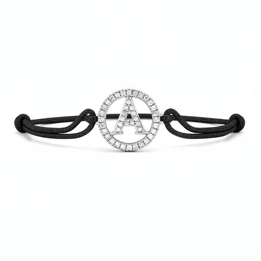 Silver diamond alphabet A bracelet with black adjustable cord on white background