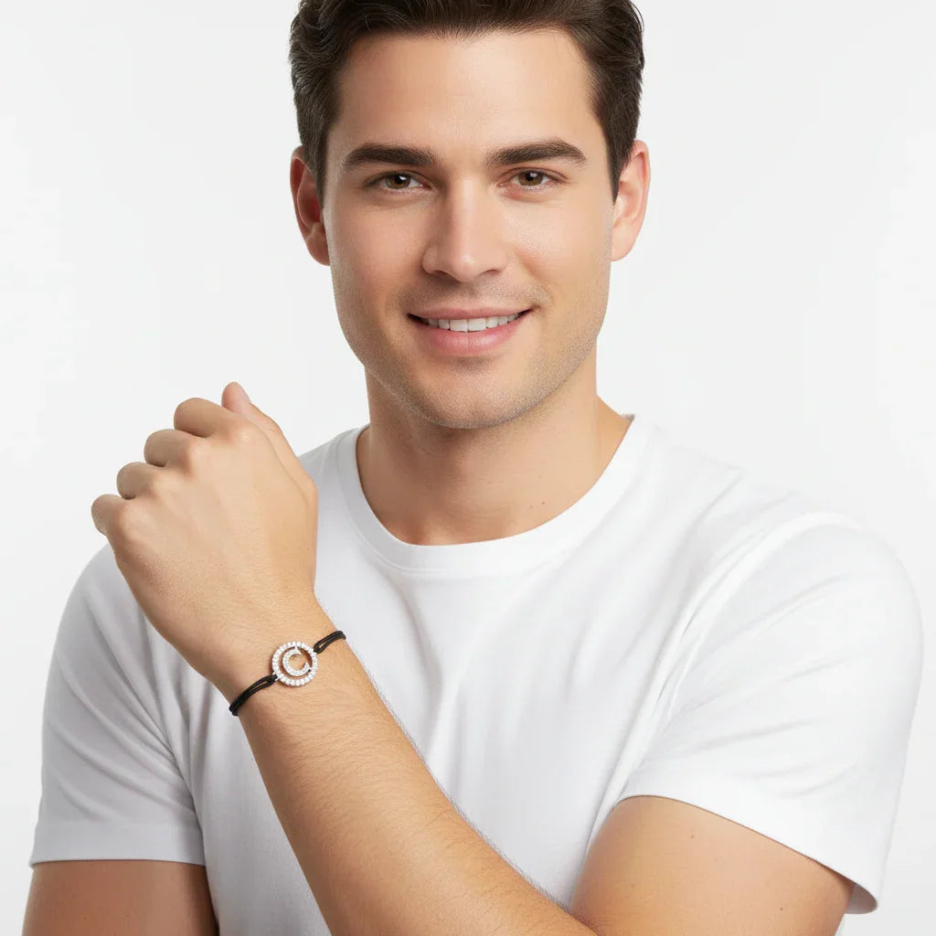 Man wearing a silver diamond alphabet C bracelet on black cord