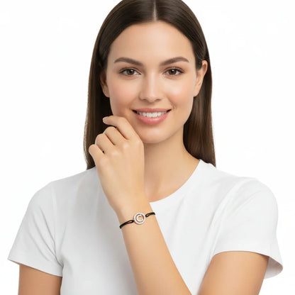 Woman wearing silver diamond alphabet C bracelet with black adjustable strap