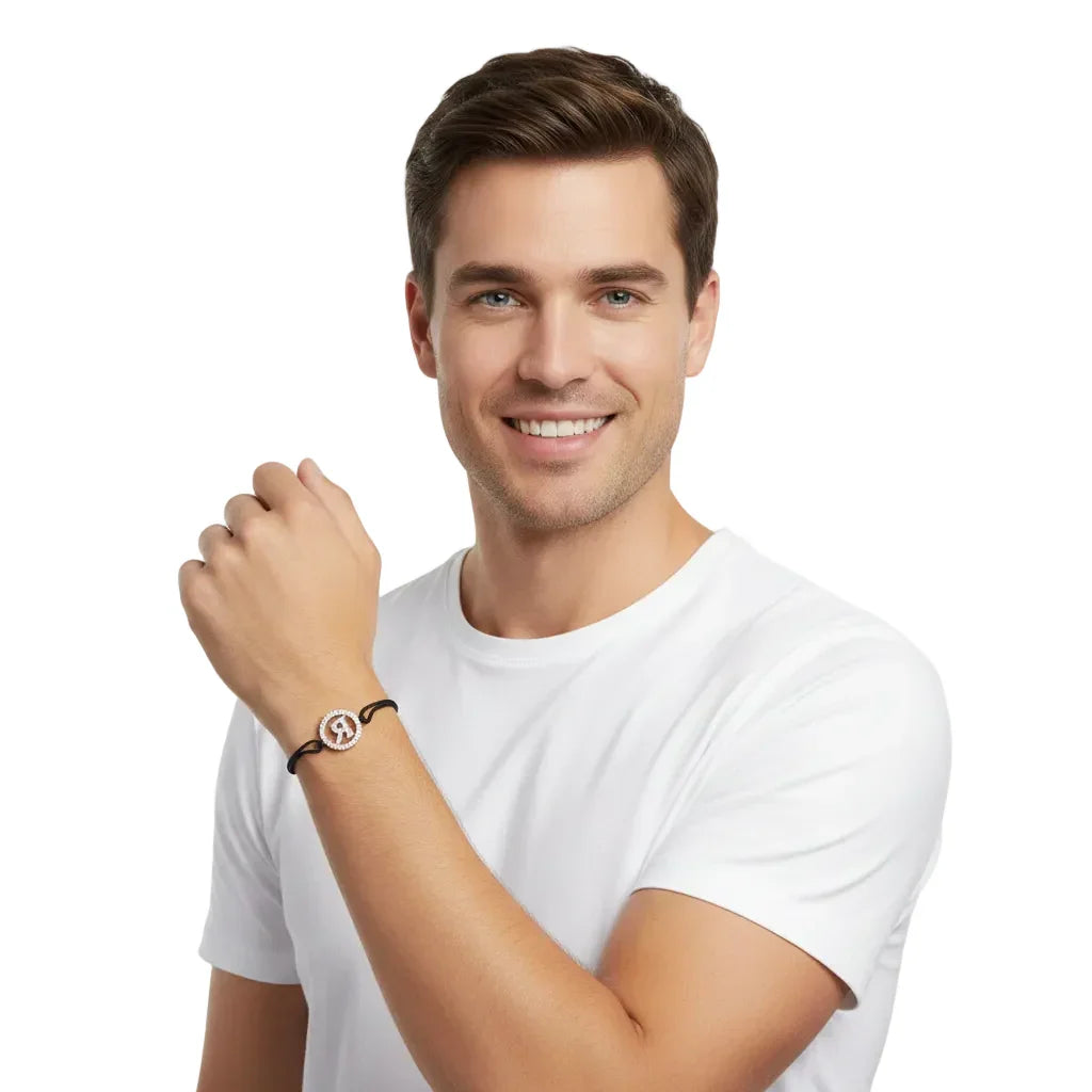 Man wearing diamond alphabet R bracelet with silver and black cord, stylish jewelry accessory