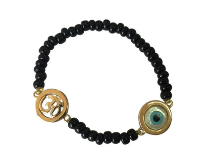 Om & Evil eye charm in gold on black beads for new born - Jewelslane