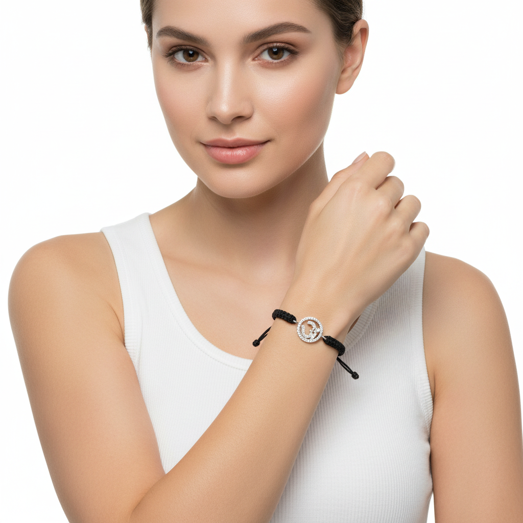 Aum Bracelet in Silver with Diamonds on Nylon Braided Thread from Aumkaara