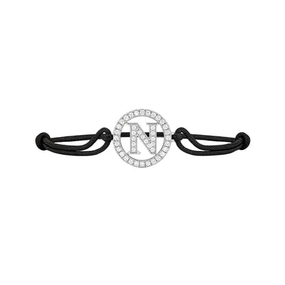 diamond letter N pendant bracelet with black cord on white background