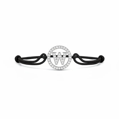 Diamond letter W bracelet with black adjustable cord and circular silver setting