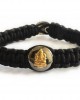 Gold Ganesh charm on silver bracelet